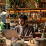 Small business owner working on laptop